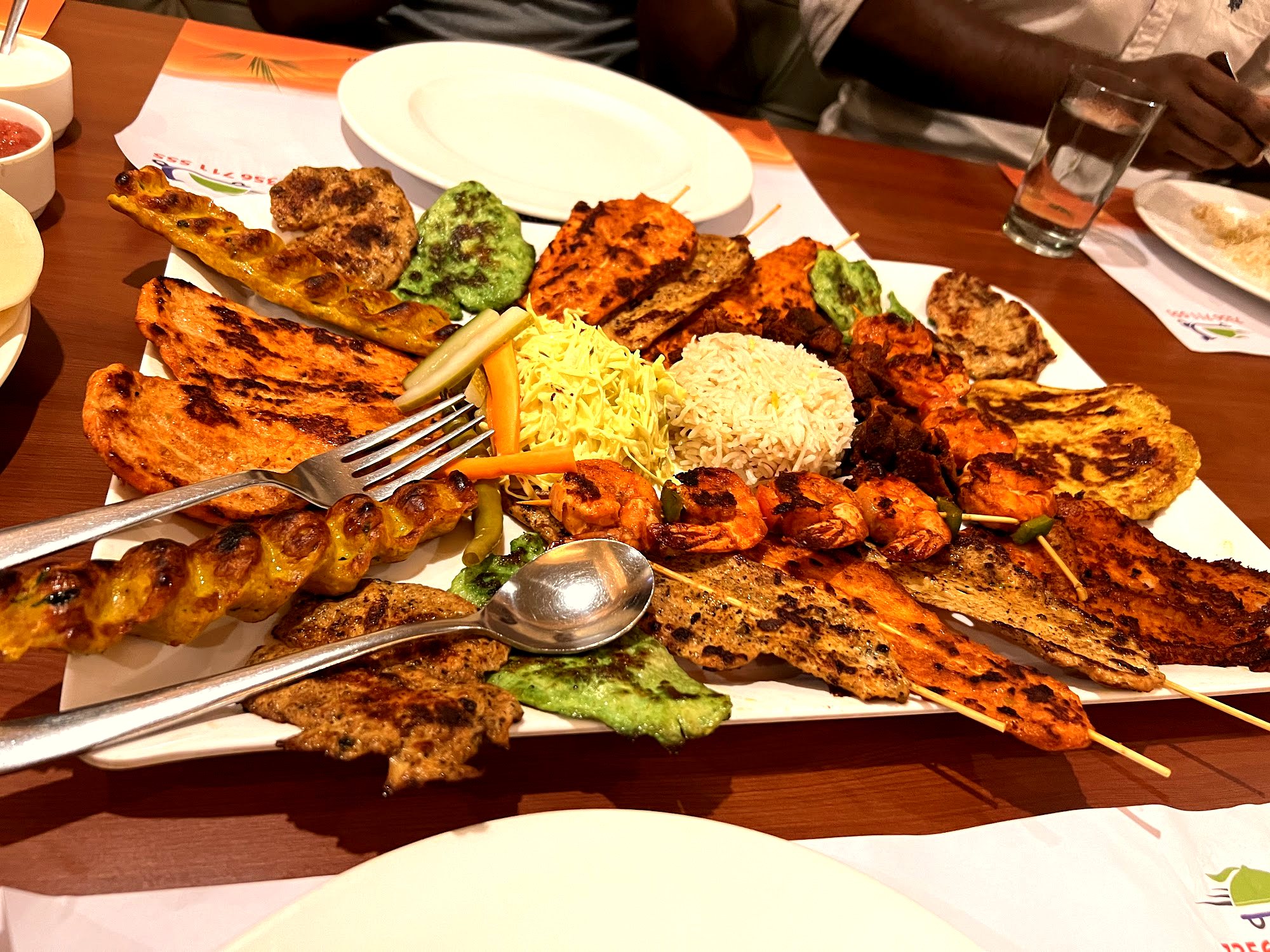 A charcoal mixed-grill and mandi feast for the table